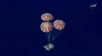The Artemis II Orion capsule splashes down in the Pacific Ocean, on Friday, 10 April 2026.